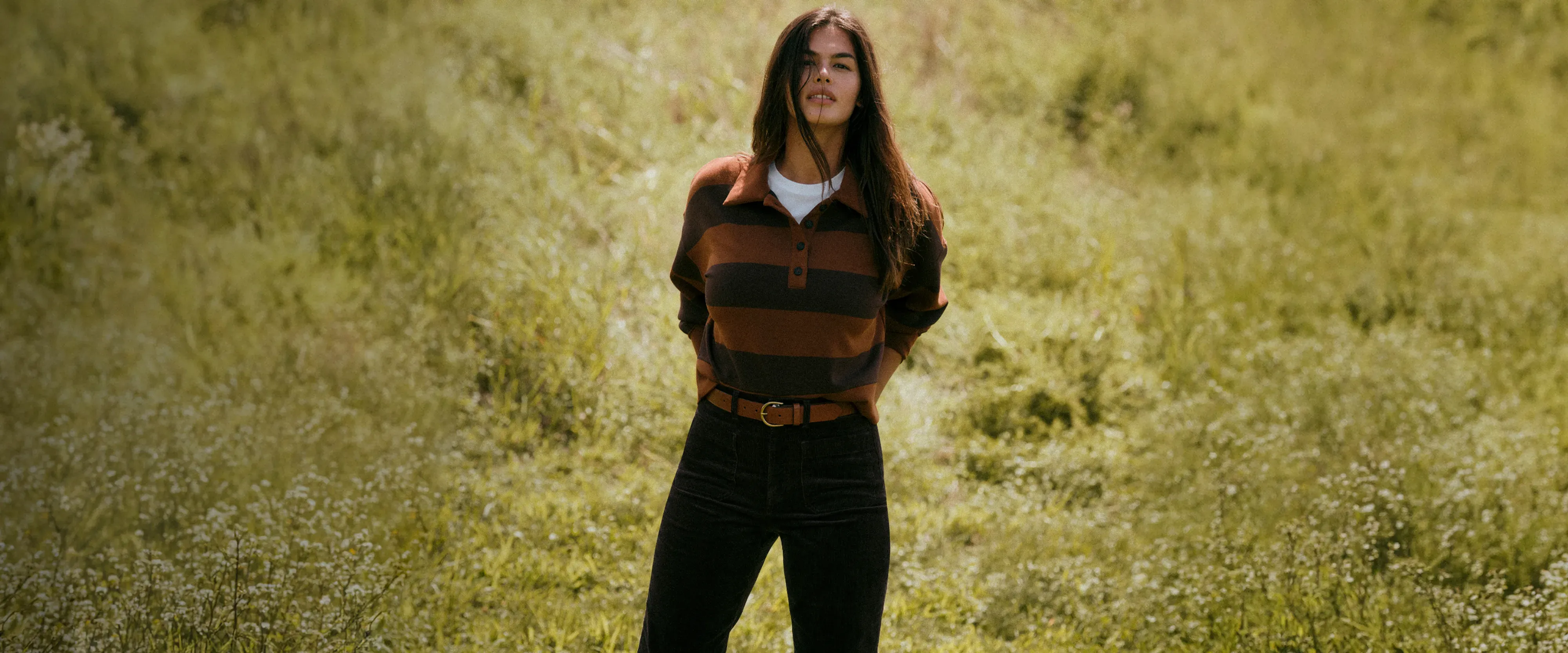 Model wearing an AirEssentials rugby top in a field